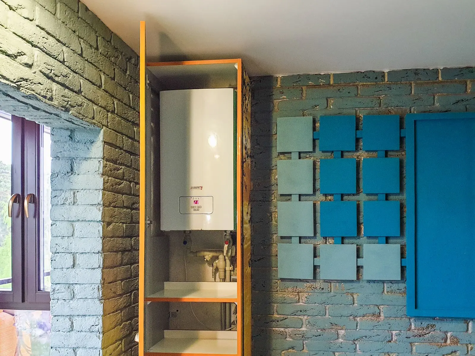 Compact wall-mounted tankless water heater installed in a home